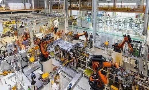 Industrial robots working on a manufacturing assembly line
